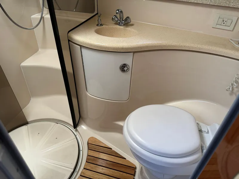 Slide: The Image of 2007 Regal 4060 COMMODORE yacht bathroom with shower, sink, and toilet. - 18