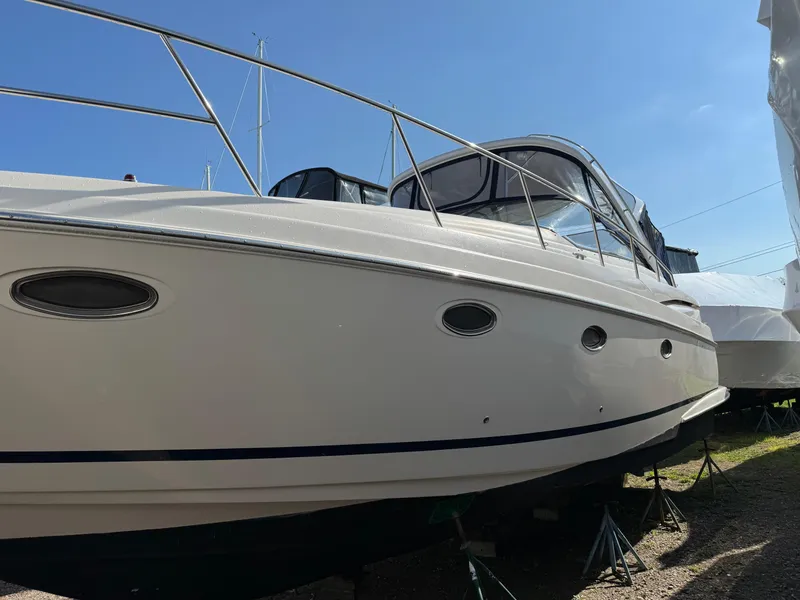 Slide: The Image of 2007 Regal 4060 COMMODORE yacht on dry dock under clear blue sky. - 2