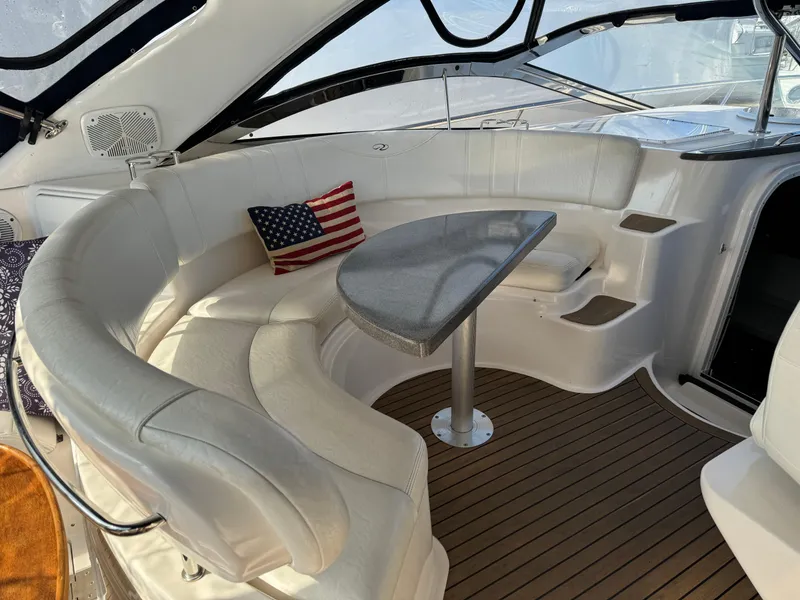 Slide: The Image of Luxurious seating area on a 2007 Regal 4060 COMMODORE yacht with American flag pillow. - 8