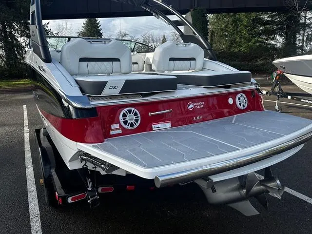 Slide: The Image of 2024 Regal LS4 boat with red and white exterior, rear view. - 4