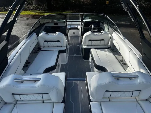 Slide: The Image of 2024 Regal LS4 boat interior with white leather seating and modern design. - 6