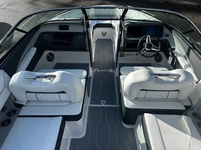 Slide: The Image of 2024 Regal LS4 boat interior with white leather seats and modern dashboard. - 7