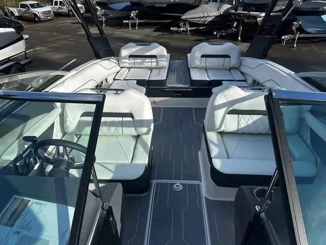 Slide: The Image of 2024 Regal LS4 boat interior with luxurious white seating and modern design. - 9