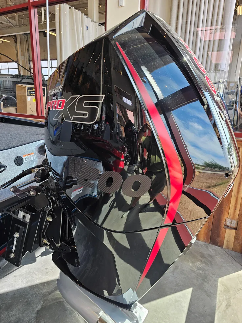 Slide: The Image of 2024 Triton 19 TrX boat engine with sleek black and red design. - 4