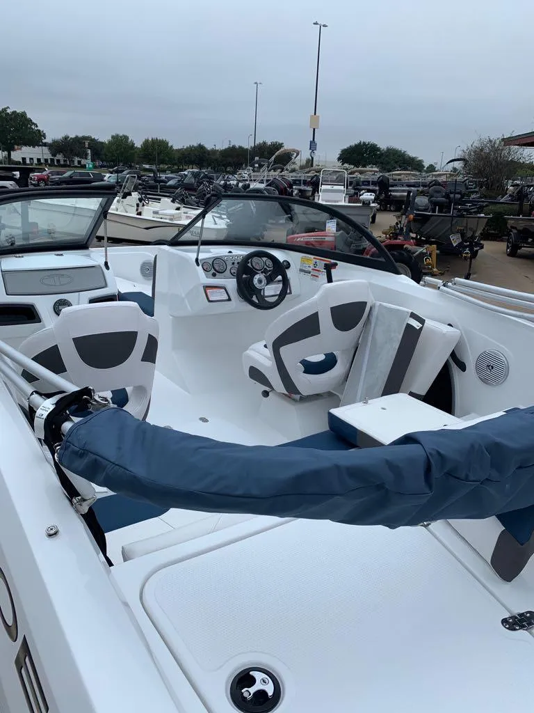 Slide: The Image of 2024 Tahoe 185 S boat interior with seating and steering wheel. - 3