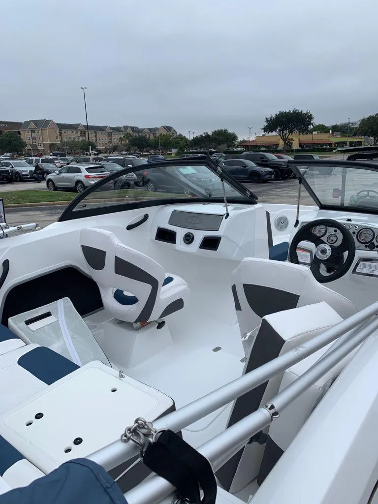 Slide: The Image of 2024 Tahoe 185 S boat interior with modern dashboard and seating. - 4