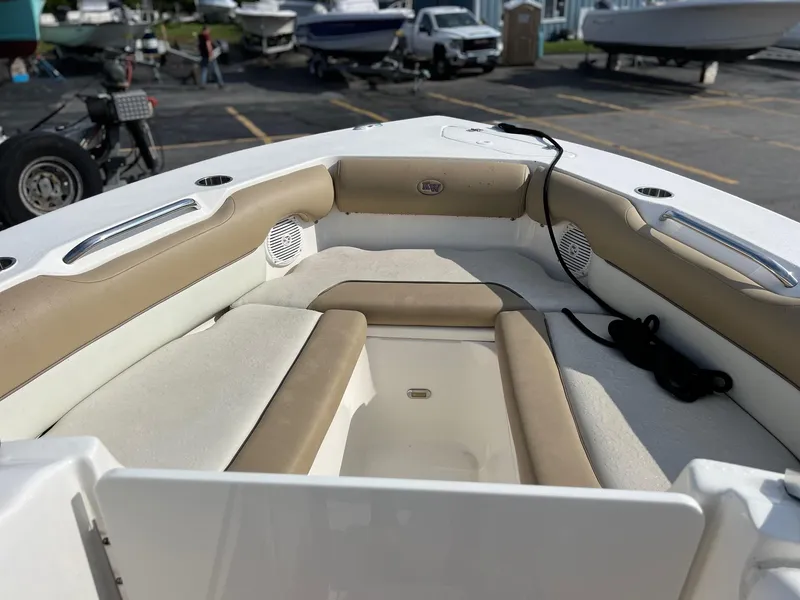Slide: The Image of 2020 Key West 239 DFS boat with cushioned seating and storage. - 11