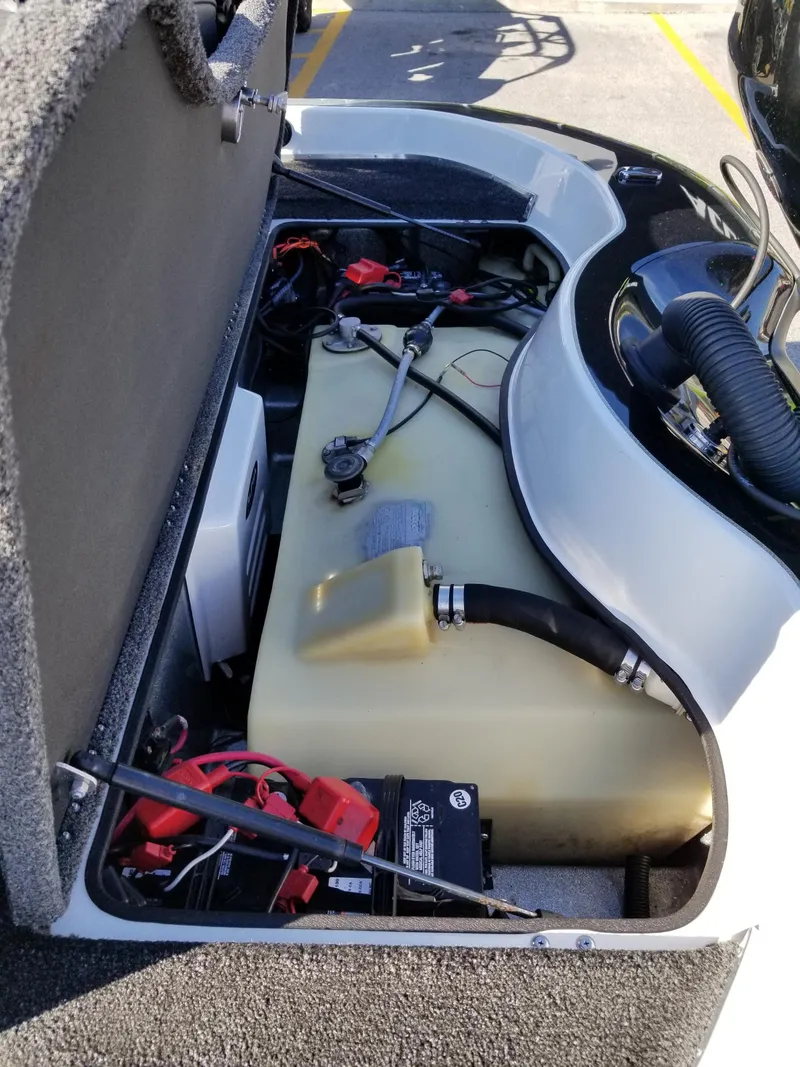 Slide: The Image of 2014 Legend Boats ALPHA 191 SCX engine compartment with fuel tank and battery. - 12