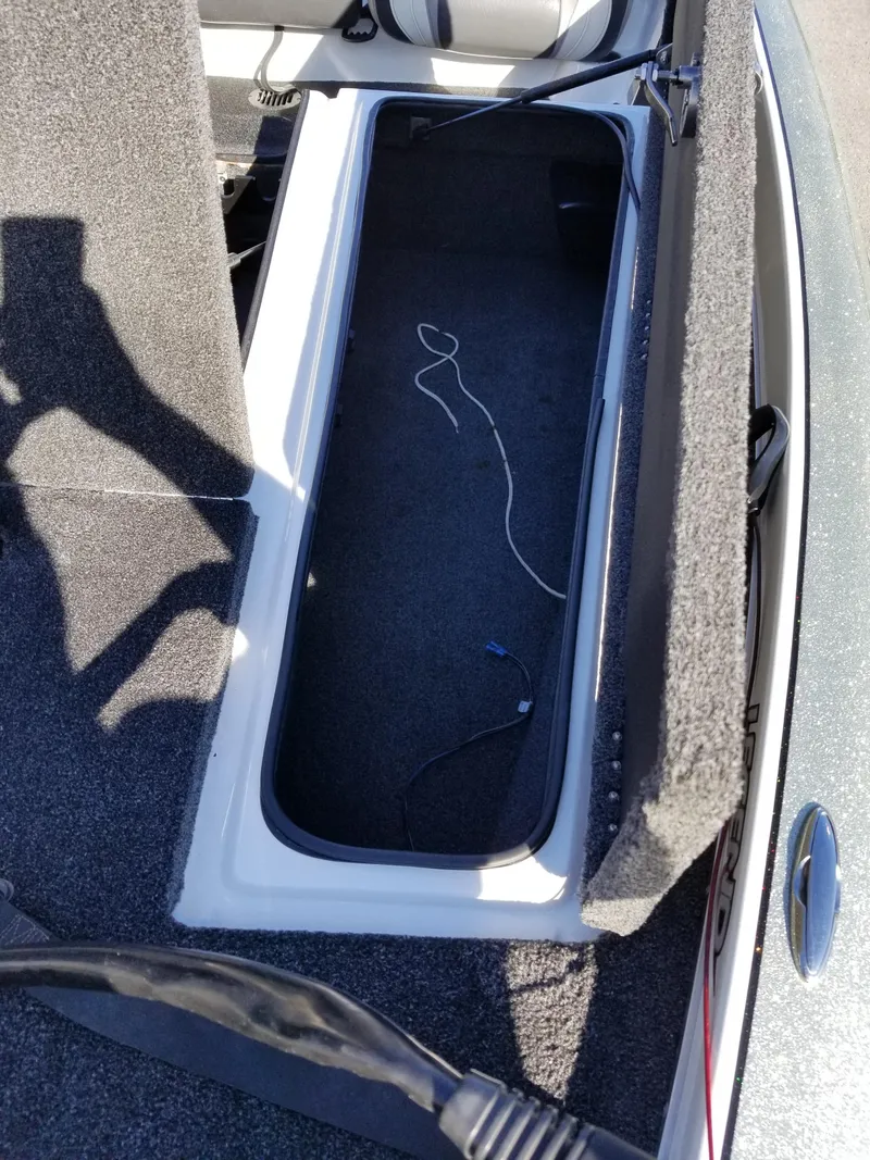 Slide: The Image of 2014 Legend Boats ALPHA 191 SCX storage compartment with open lid. - 8