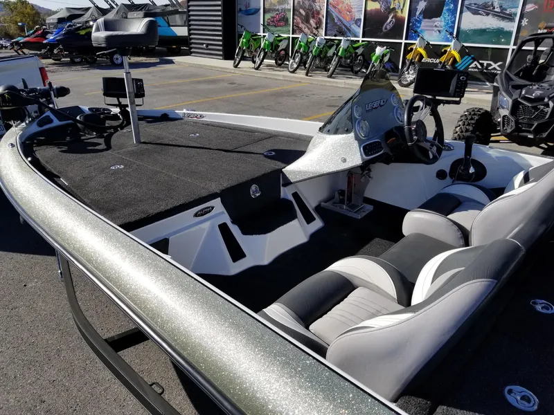Slide: The Image of 2014 Legend Boats ALPHA 191 SCX fishing boat interior with seating and control console. - 9