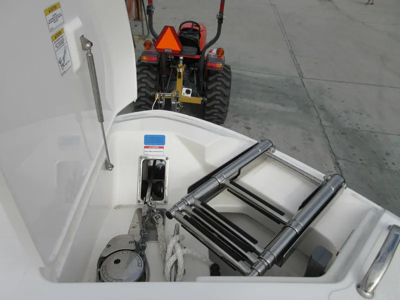 Slide: The Image of 2021 Boston Whaler 280 Vantage boat anchor storage and ladder compartment. - 15