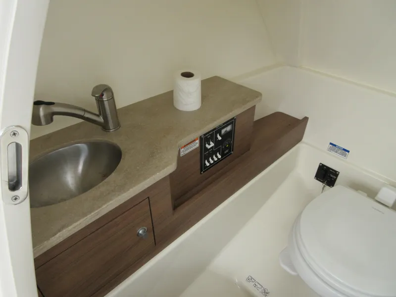 Slide: The Image of 2021 Boston Whaler 280 Vantage boat bathroom with sink and toilet. - 17