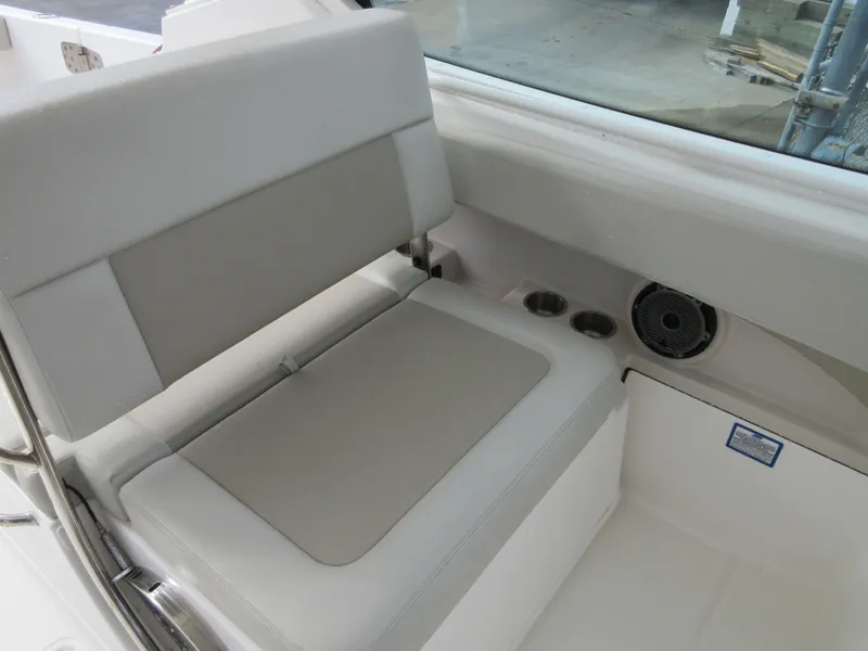 Slide: The Image of 2021 Boston Whaler 280 Vantage boat interior seating and cup holders. - 18
