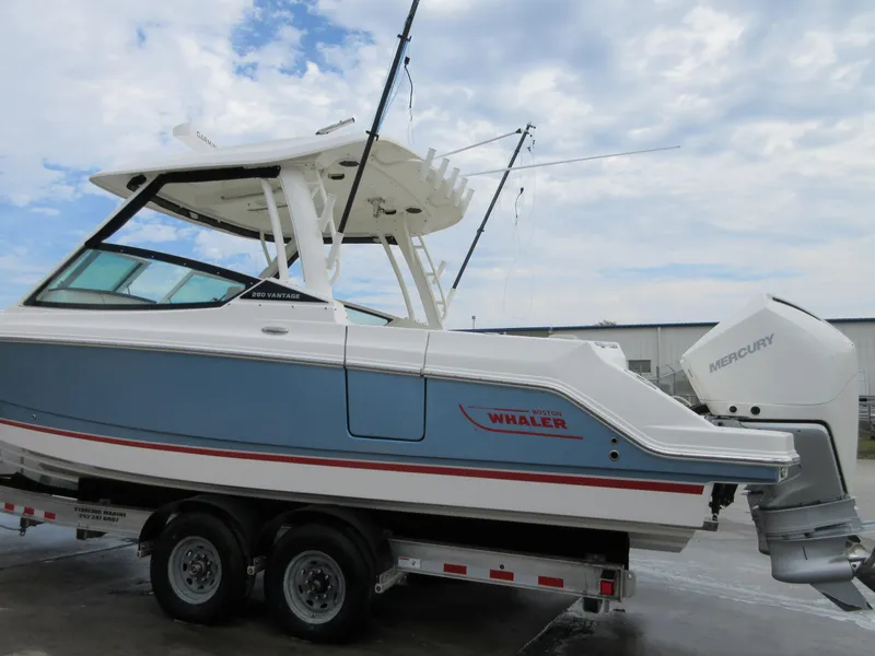 Slide: The Image of 2021 Boston Whaler 280 Vantage boat on trailer with twin Mercury engines. - 2