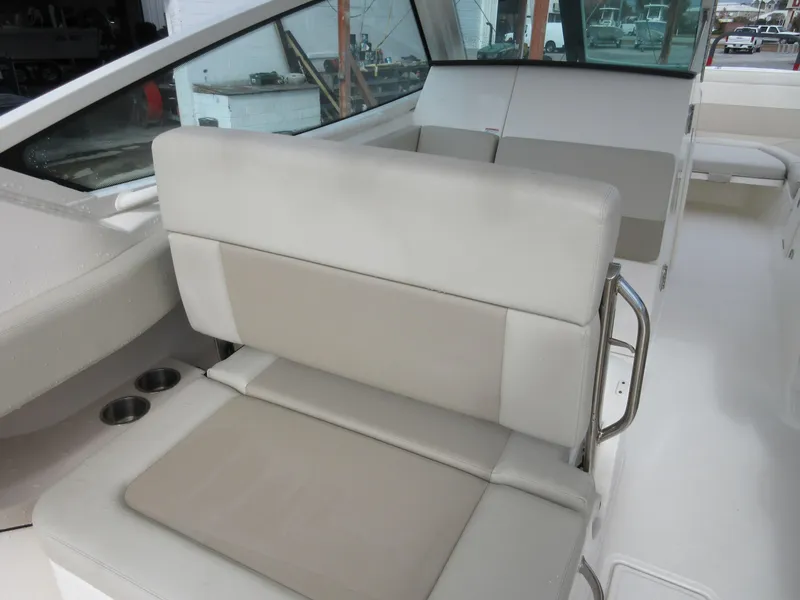 Slide: The Image of 2021 Boston Whaler 280 Vantage boat interior seating and cup holders. - 22