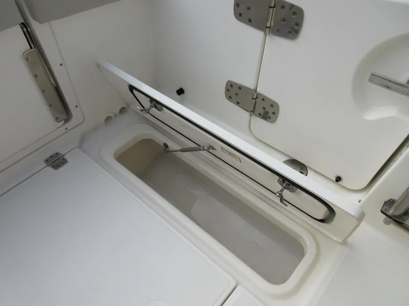 Slide: The Image of 2021 Boston Whaler 280 Vantage storage compartment with open hatch. - 5