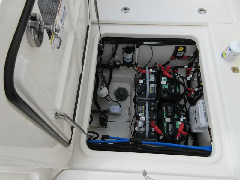 Slide: The Image of 2021 Boston Whaler 280 Vantage battery compartment with wiring and components. - 8