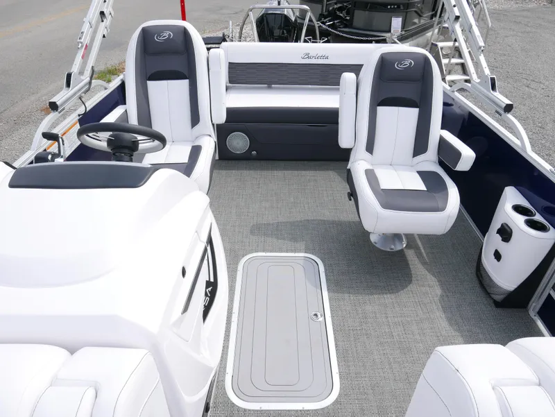 Slide: The Image of 2024 Barletta Corsa 23UC boat interior with plush seating and modern design. - 13