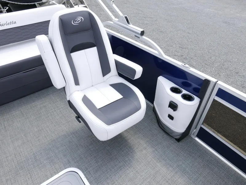 Slide: The Image of 2024 Barletta Corsa 23UC boat interior with plush seating and cup holders. - 16