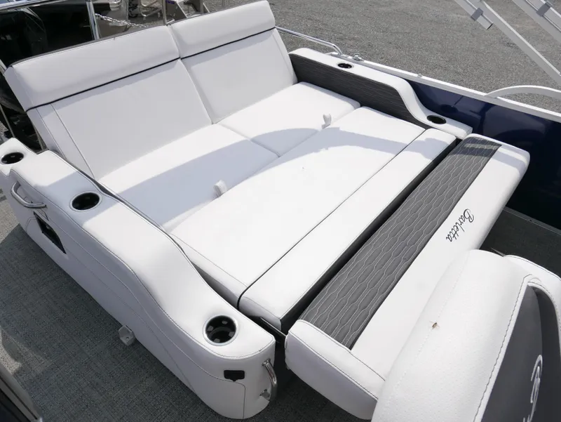 Slide: The Image of 2024 Barletta Corsa 23UC boat with luxurious white seating and cup holders. - 22