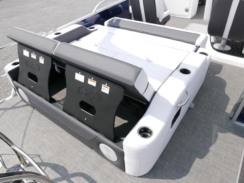 Slide: The Image of 2024 Barletta Corsa 23UC boat interior with adjustable seating and cup holders. - 23