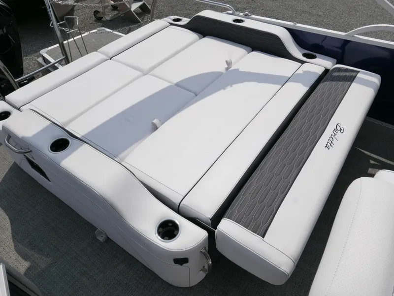 Slide: The Image of 2024 Barletta Corsa 23UC boat seating with white upholstery and cup holders. - 25