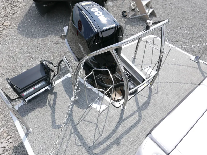 Slide: The Image of 2024 Barletta Corsa 23UC boat with motor and railing, viewed from above. - 5