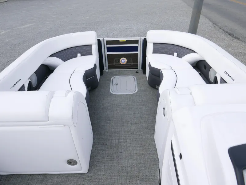 Slide: The Image of 2024 Barletta Corsa 23UC boat interior with white seating and gray flooring. - 6