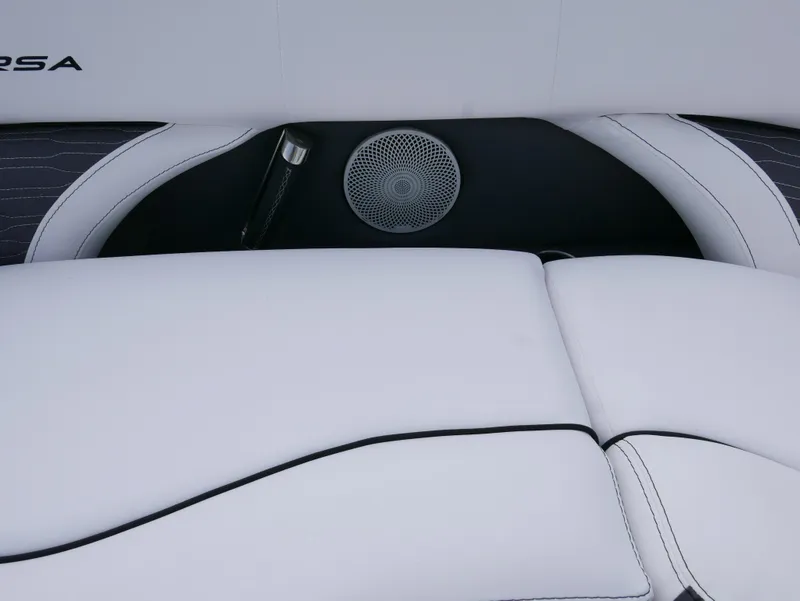 Slide: The Image of 2024 Barletta Corsa 23UC boat interior with white cushioned seating and speaker. - 9