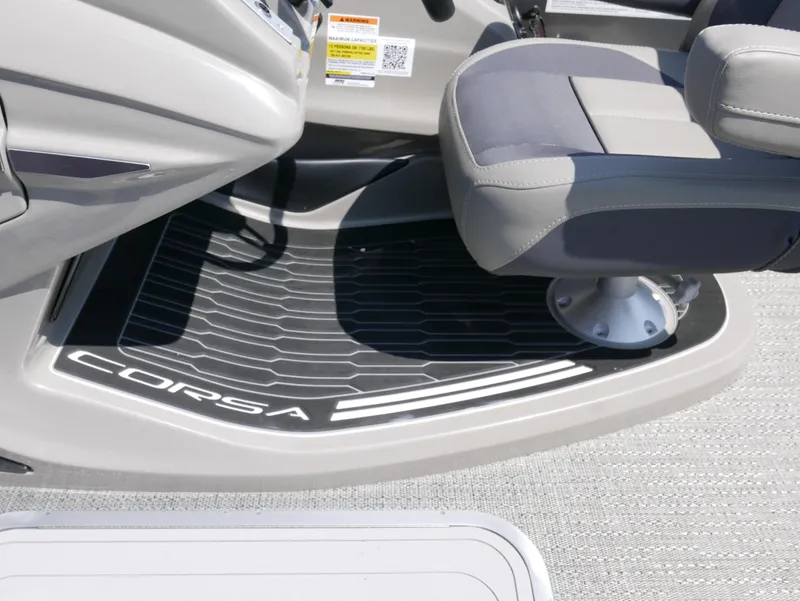 Slide: The Image of 2024 Barletta Corsa 23UC boat interior with branded flooring and seating. - 17