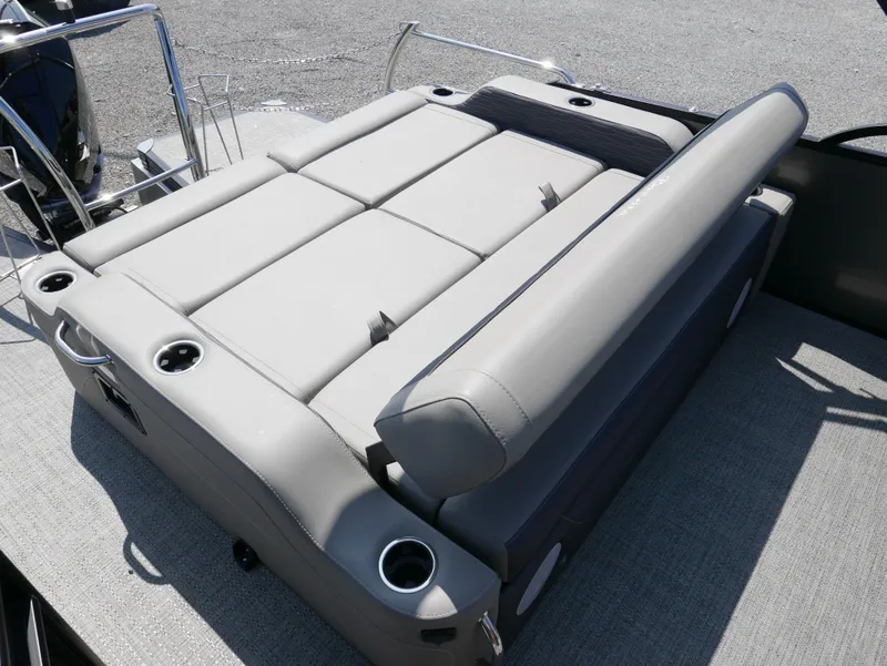 Slide: The Image of 2024 Barletta Corsa 23UC boat with gray seating and cup holders. - 23