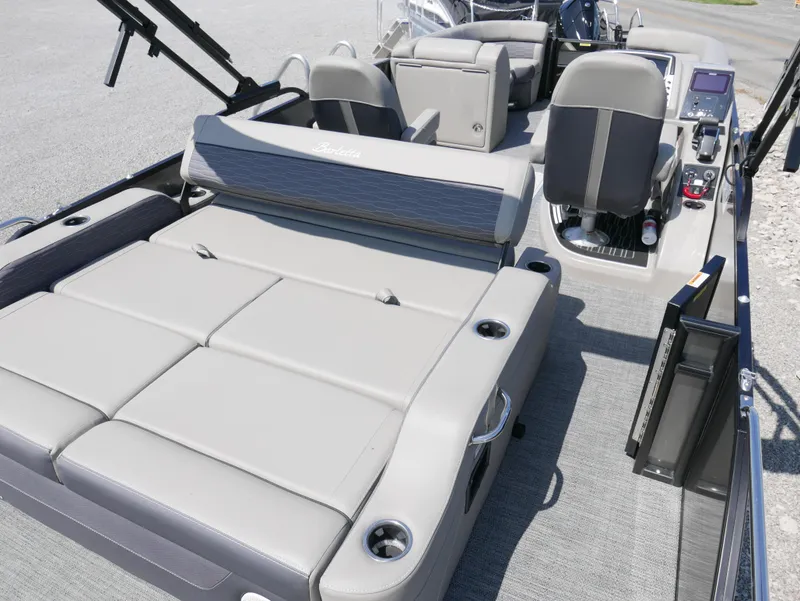 Slide: The Image of 2024 Barletta Corsa 23UC boat interior with plush seating and modern controls. - 6