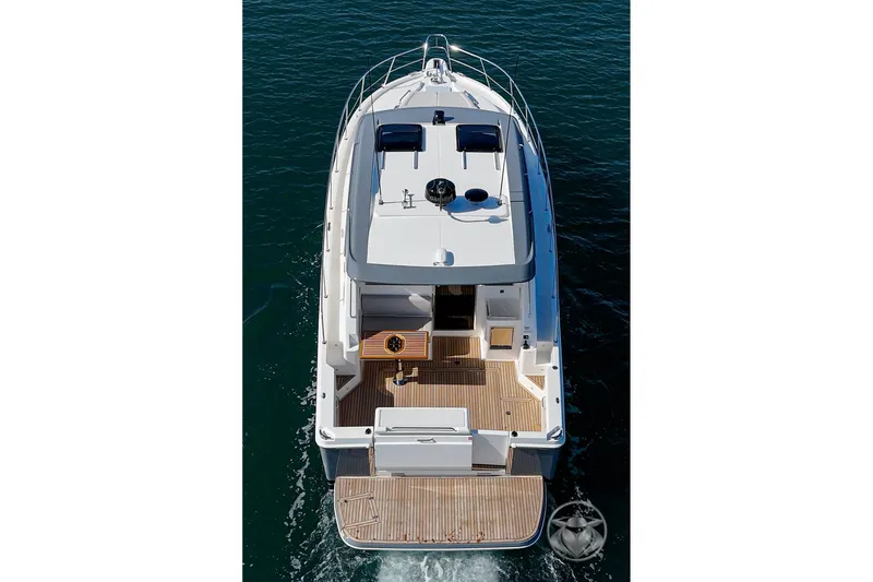 Slide: The Image of 2026 Riviera 395 SUV yacht, aerial view, cruising on open water. - 11