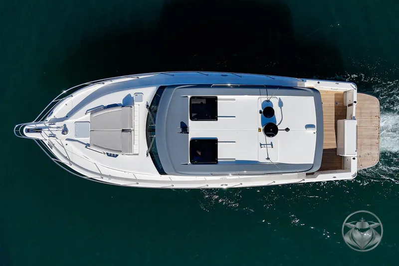 Slide: The Image of Aerial view of 2026 Riviera 395 SUV yacht cruising on water. - 12