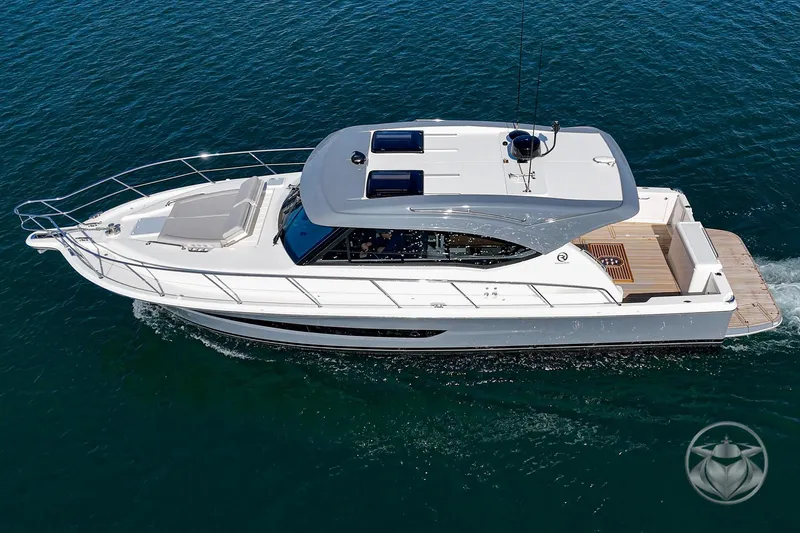 Slide: The Image of 2026 Riviera 395 SUV cruising on open water, showcasing sleek design and luxury features. - 13