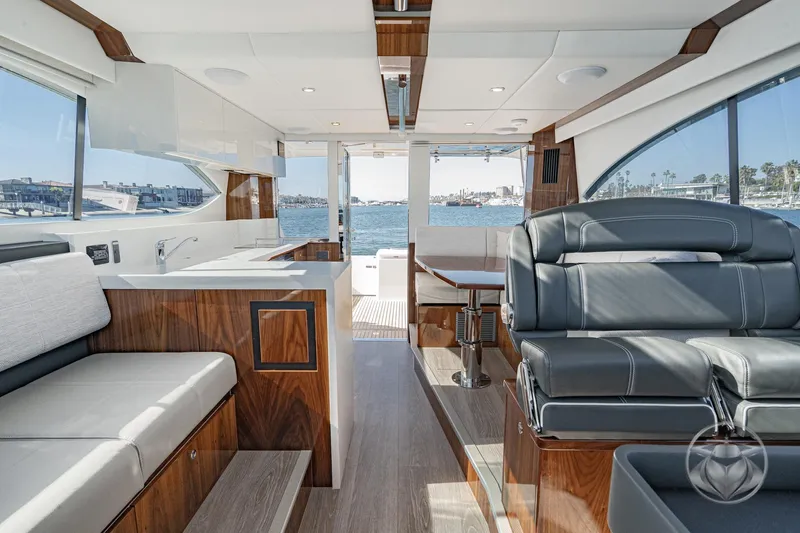 Slide: The Image of Luxurious interior of 2026 Riviera 395 SUV yacht with modern seating and ocean view. - 23