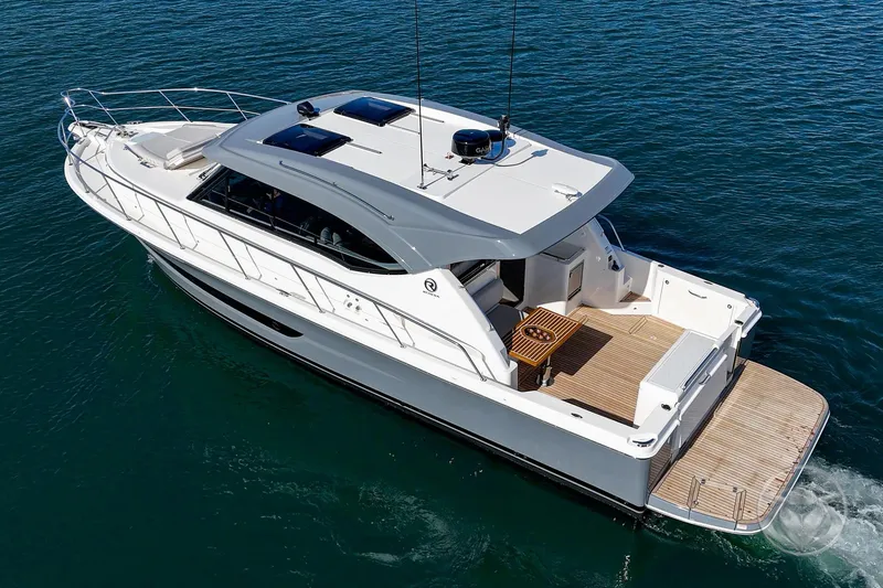 Slide: The Image of 2026 Riviera 395 SUV luxury yacht cruising on open water. - 3