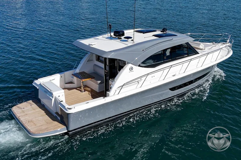 Slide: The Image of 2026 Riviera 395 SUV cruising on open water, showcasing sleek design and modern features. - 4