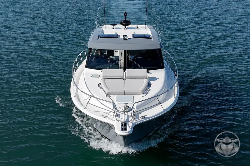 Slide: The Image of 2026 Riviera 395 SUV cruising on open water, front view. - 8