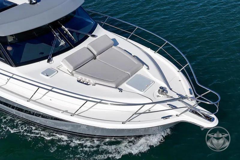 Slide: The Image of 2026 Riviera 395 SUV cruising on water, featuring sleek design and spacious deck. - 9