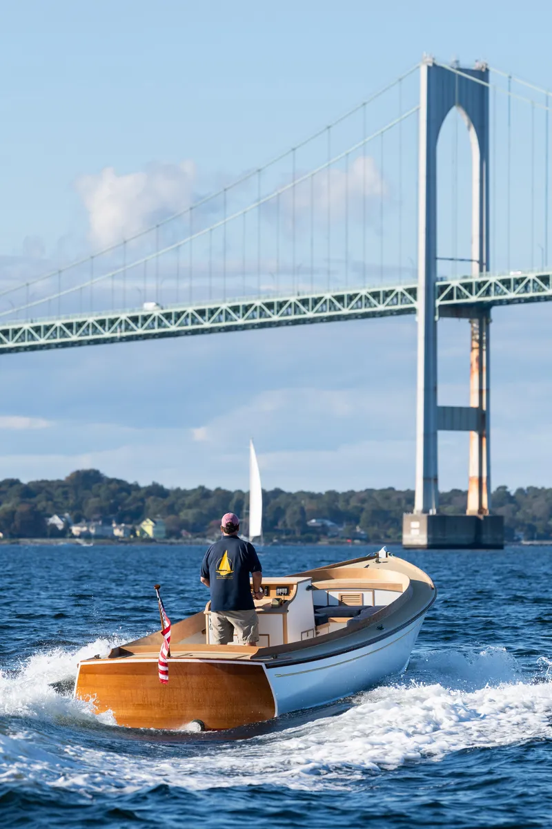 Slide: The Image of 2021 Center Console East Passage 24 boat cruising near a bridge. - 10
