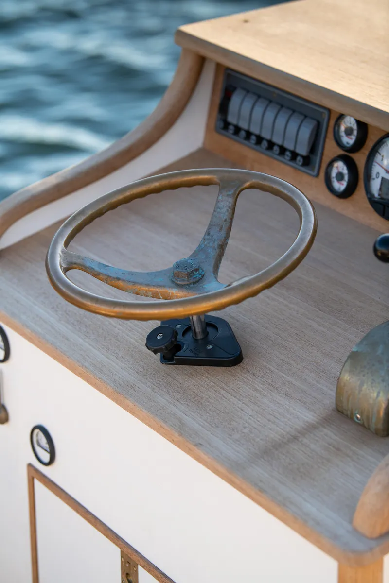 Slide: The Image of 2021 Center Console East Passage 24 boat steering wheel and dashboard. - 17
