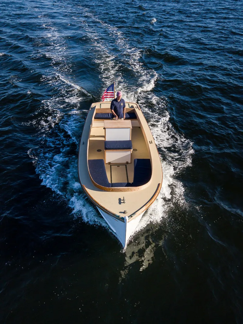 Slide: The Image of 2021 Center Console East Passage 24 boat cruising on open water. - 4