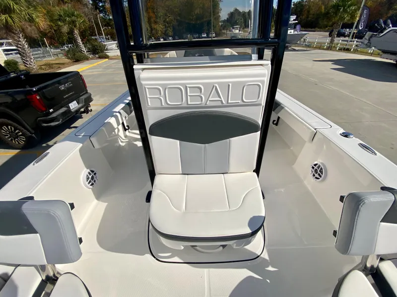 Slide: The Image of 2024 Robalo 226 Cayman boat interior with white and gray seating. - 18