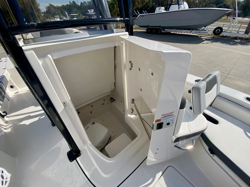 Slide: The Image of 2024 Robalo 226 Cayman boat interior storage compartment with open hatch. - 19