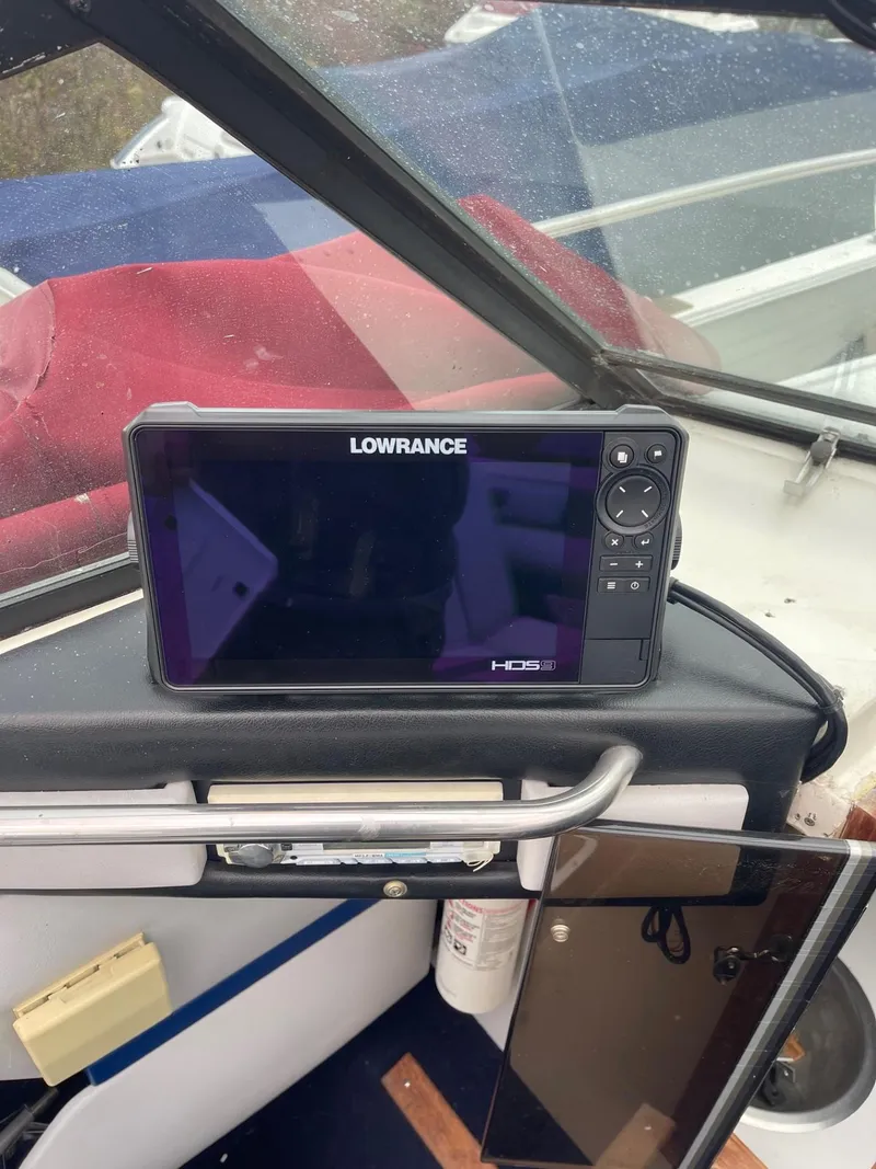 Slide: The Image of Lowrance HDS fishfinder on 1988 Regal boat dashboard. - 22