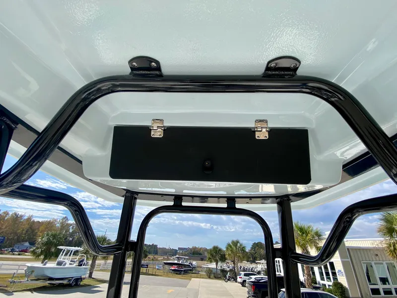 Slide: The Image of 2024 Robalo 226 Cayman boat T-top with storage compartment. - 15