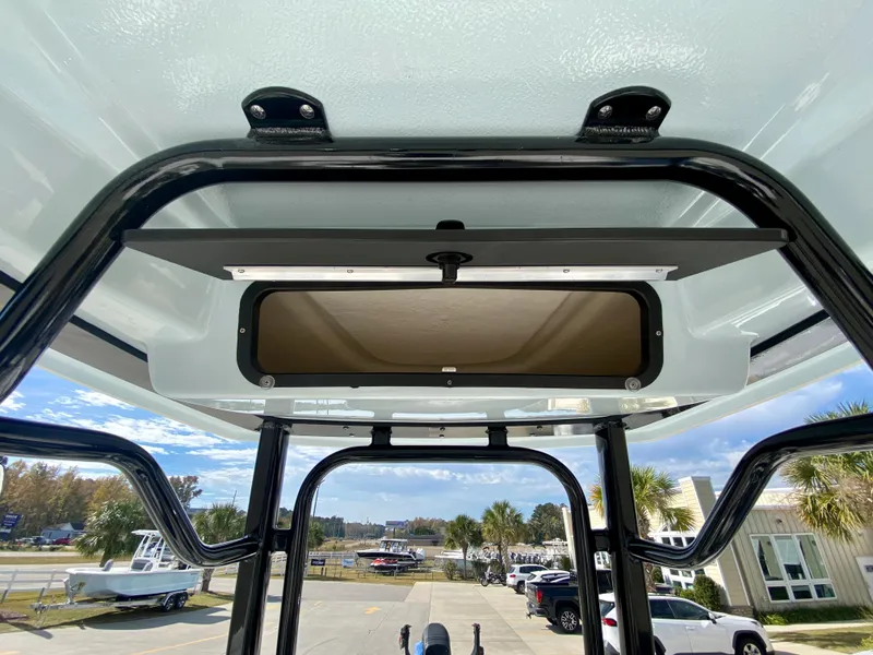 Slide: The Image of 2024 Robalo 226 Cayman T-top view with storage compartment. - 16