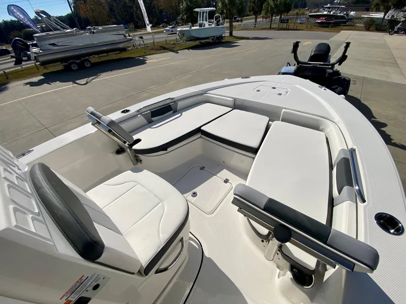 Slide: The Image of 2024 Robalo 226 Cayman boat interior with seating and steering wheel. - 17
