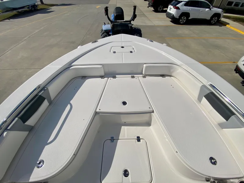 Slide: The Image of 2024 Robalo 226 Cayman boat deck with storage compartments and seating. - 20